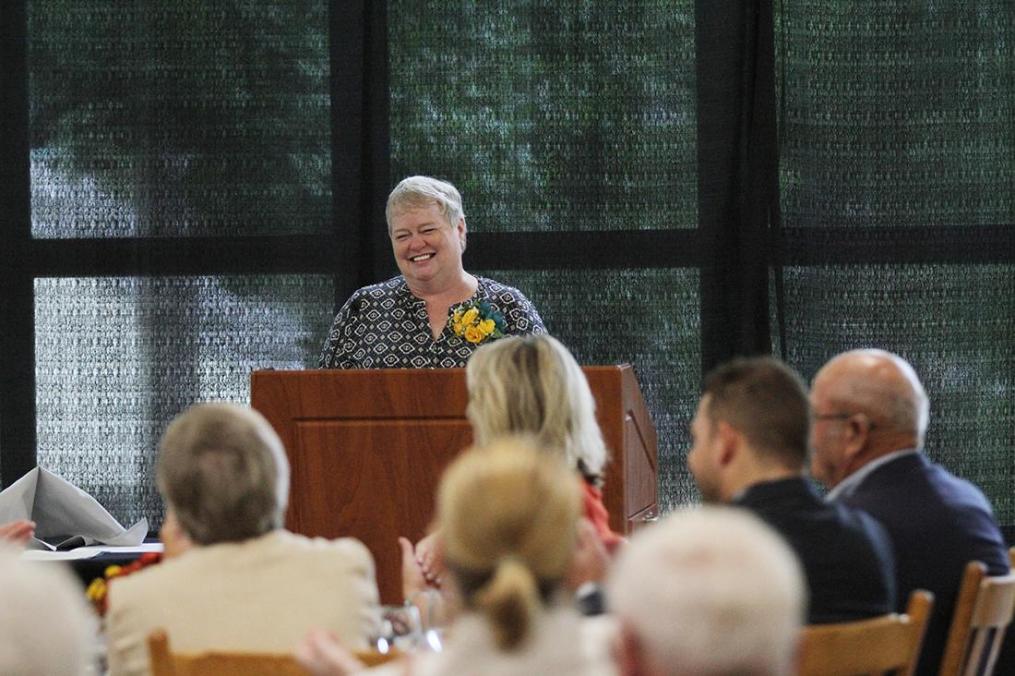 Kathy Waye stands at the podium.