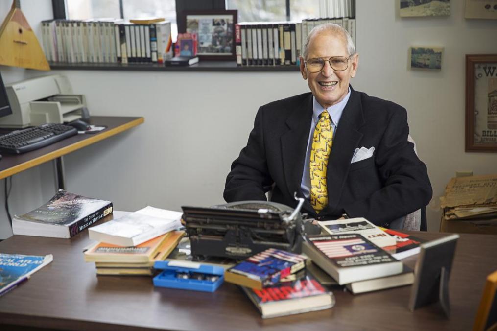 Dr. Sander Diamond sitting behind his desk