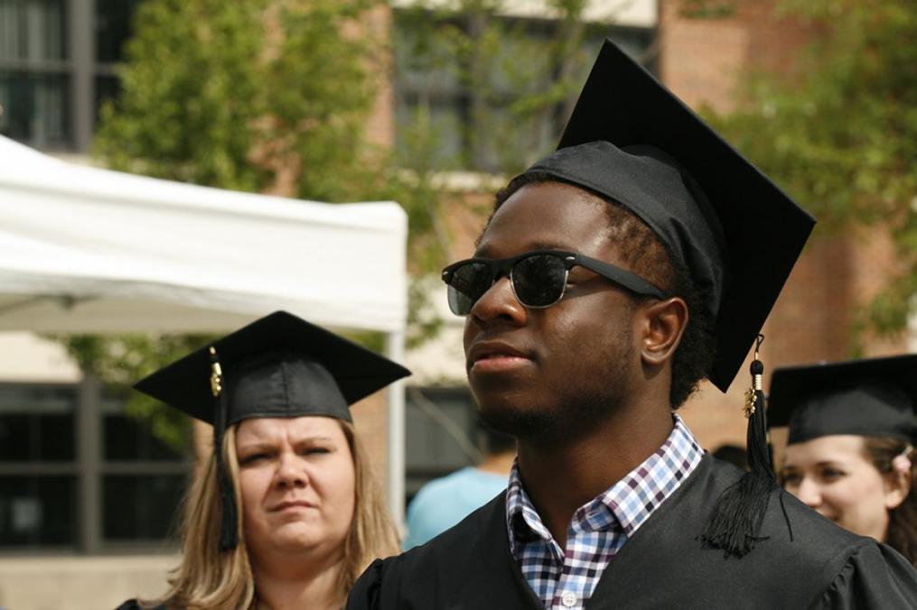 Management major Jordon Porter-Lemon enjoys the sunny Commencement Ceremony.