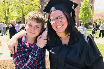Angie Laursen Burd ’09 ’M19 poses with her son, Maison, following her Keuka College graduation this past May.